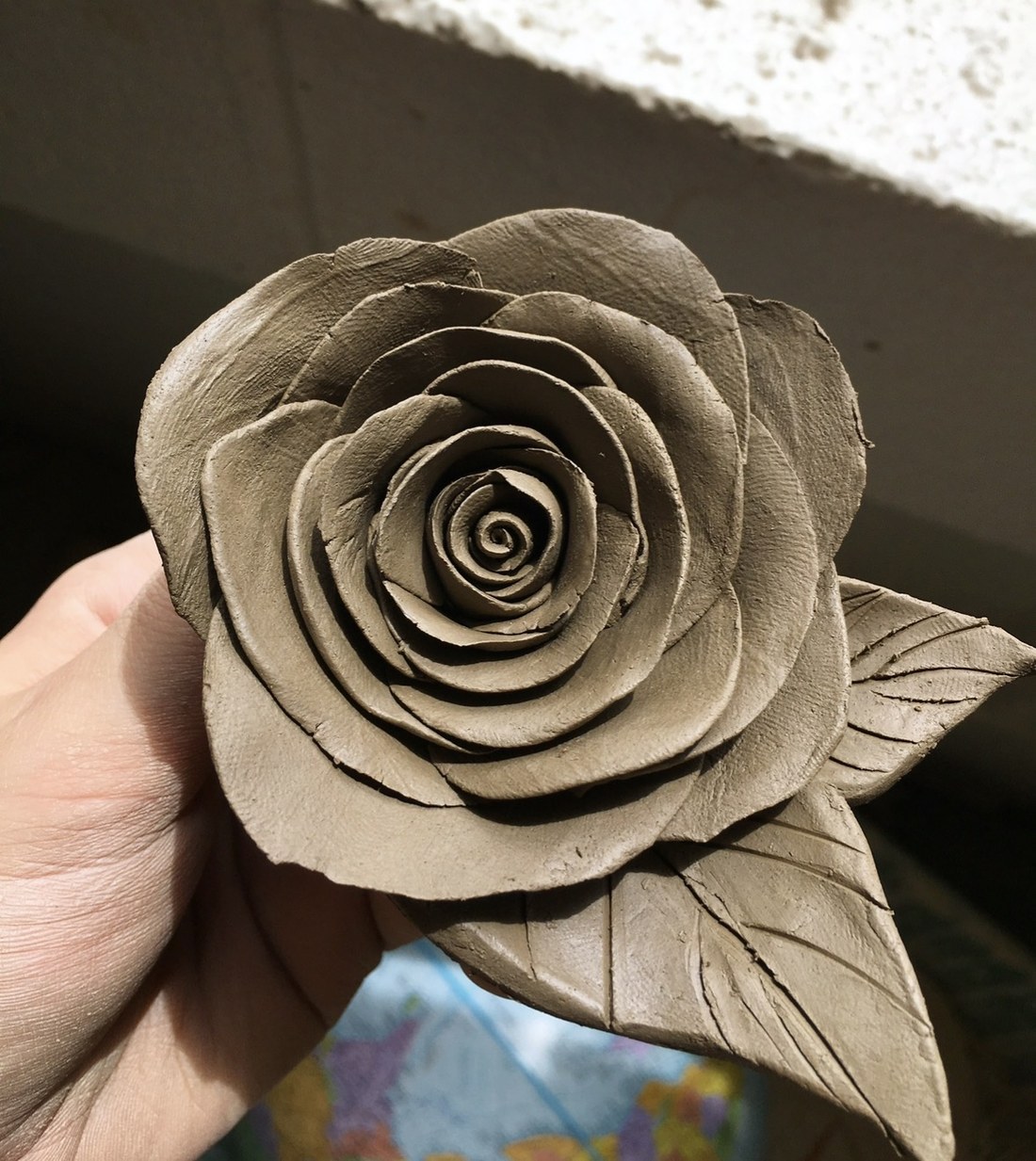 Hand-sculpted clay rose by Faye